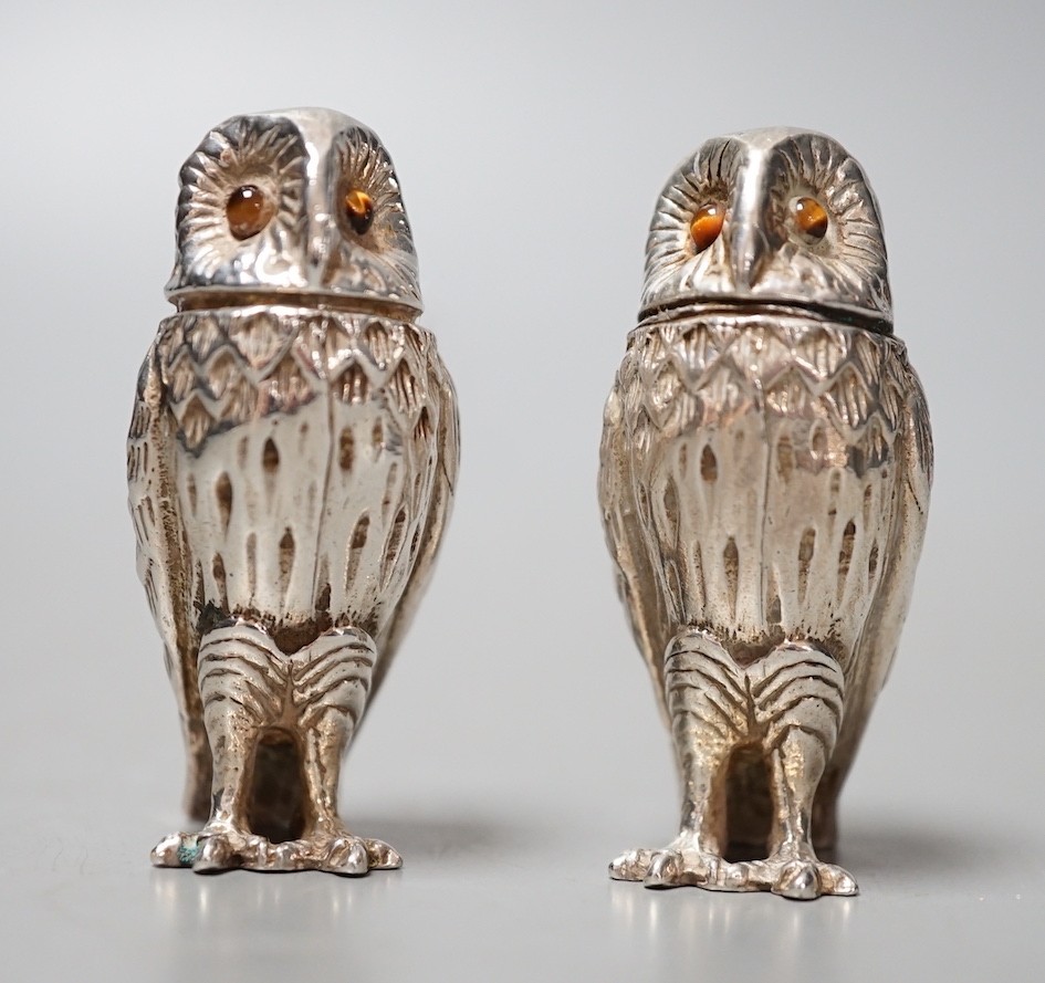 A modern novelty silver condiment, modelled as an owl and a similar unmarked companion, 52mm